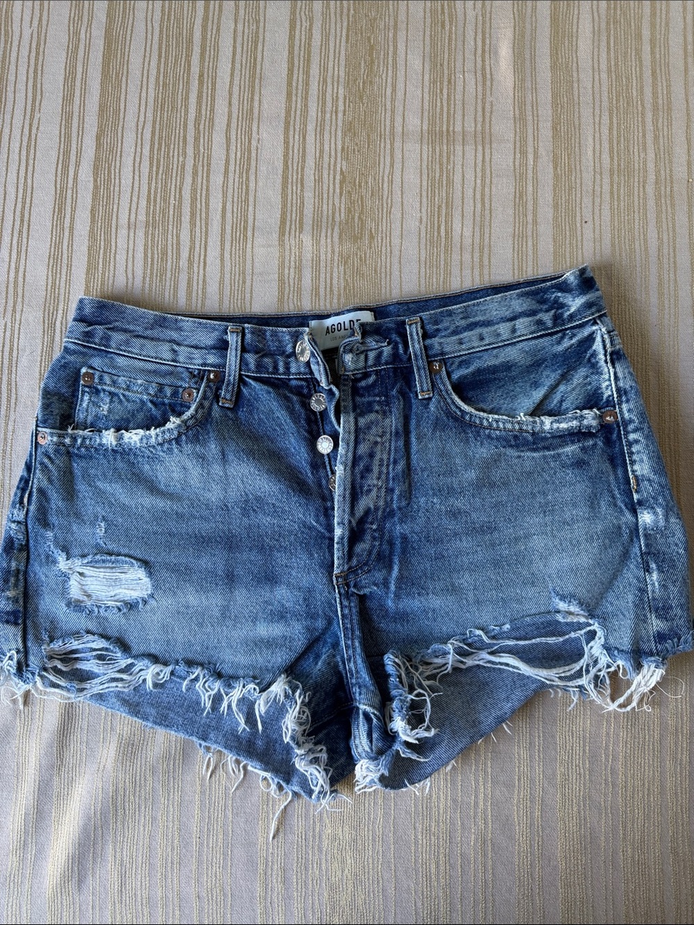 Agolde Medium Wash Distressed Denim Cutoff Shorts